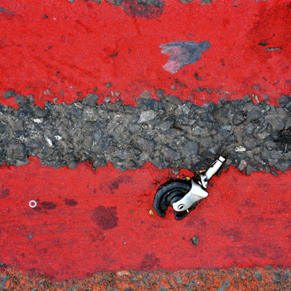 Double red lines - Road Markings & Caster Wheel. Location: Ilford Lane, Ilford, London