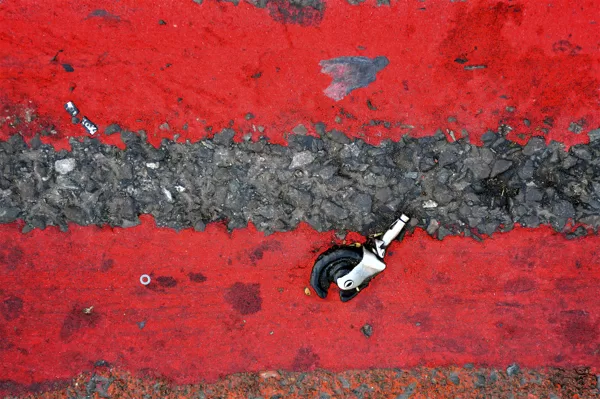 Double red lines - Road Markings & Caster Wheel. Location: Ilford Lane, Ilford, London